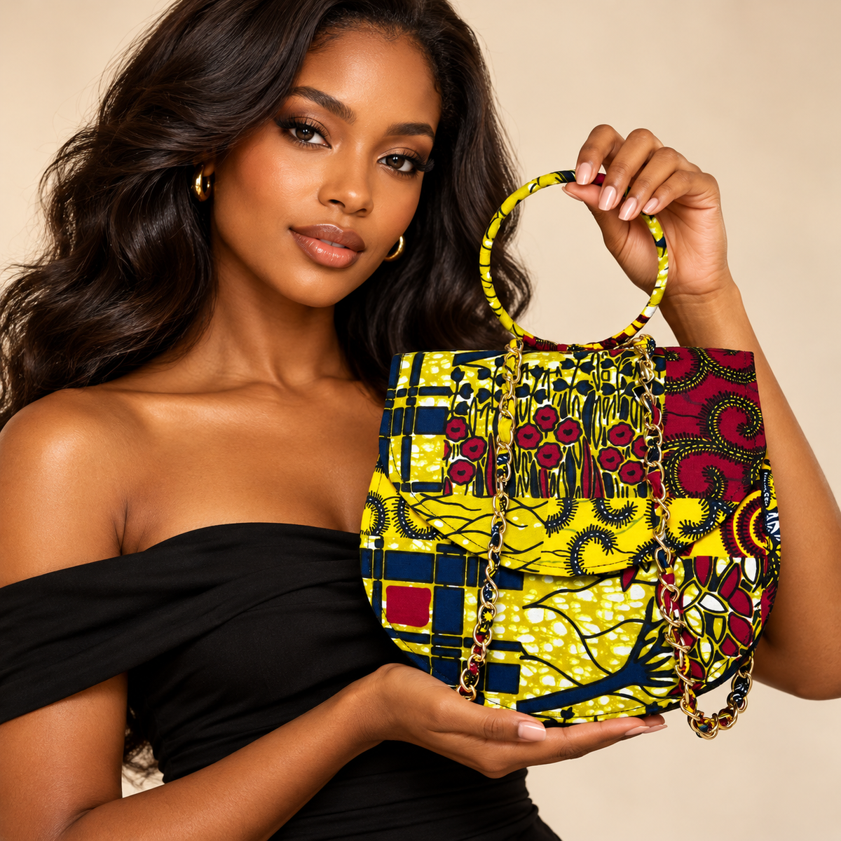 Syda African print Ankara handbag in yellow, burgundy and navy with circular handle and gold-tone chain.