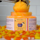ndulge in a playful burst of Halloween magic with our Candy Corn Foaming Sugar Scrub! This gentle exfoliator is packed with sugar crystals to buff away dull skin, while transforming into a creamy foam that leaves your skin feeling soft, smooth, and refreshed.