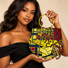 Syda African print Ankara handbag in yellow, burgundy and navy with circular handle and gold-tone chain.