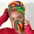 Woman wearing a colorful headscarf and matching face mask against a white background